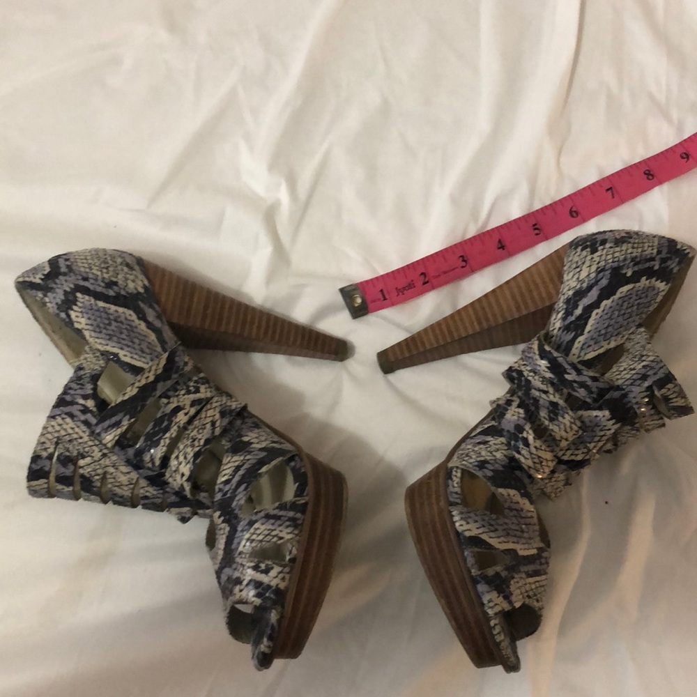 Python wooden stilettos